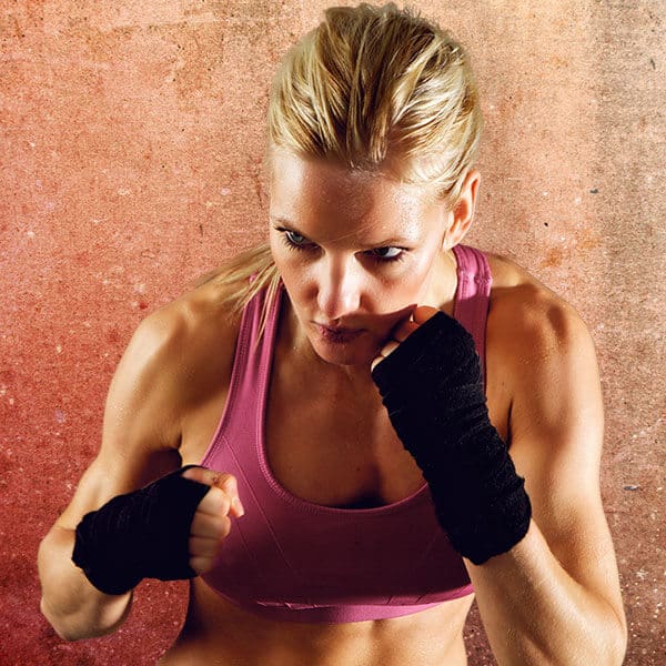 Mixed Martial Arts Lessons for Adults in Alexandria VA - Lady Kickboxing Focused Background